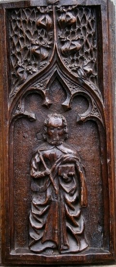 A 15th Century Carved Oak Panel Depicting St Thomas Under A Gothic Arch.