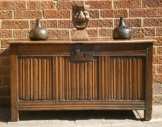 A 16th century English carved oak linenfold coffer
