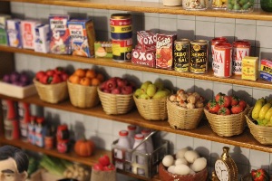 A selection of dollshouse miniature foods displayed on shop shelves in 12th scale
