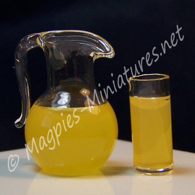 Jug of orange juice & Glass