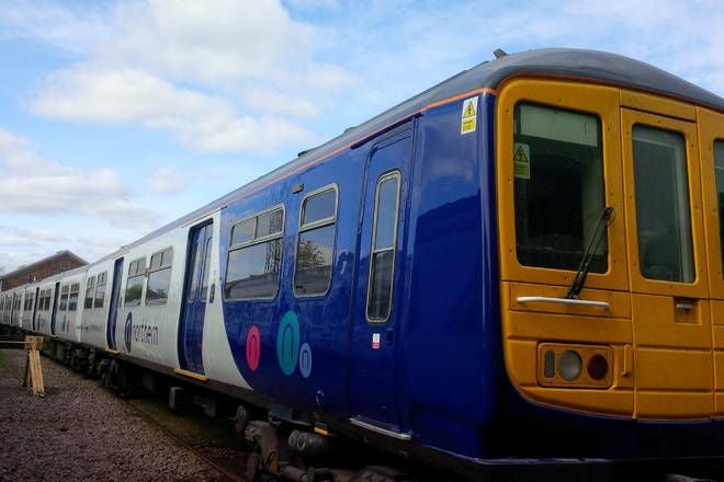 Northern class 319 EMU stabled in siding