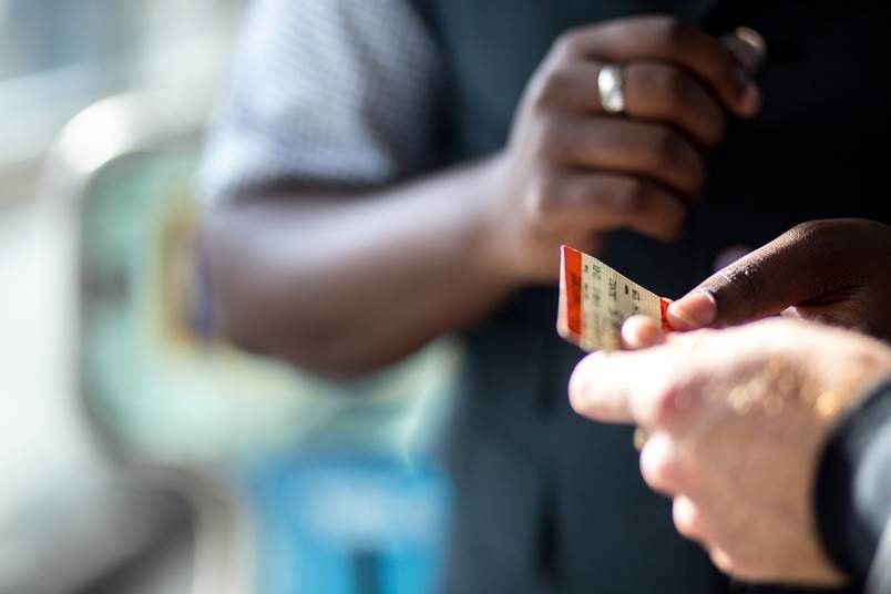 Person holding a rail ticket