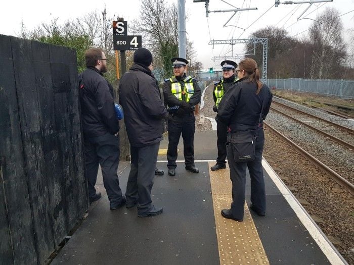 Revenue protection staff gather at end of platform