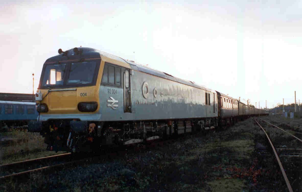 Image showing  Unknown location 	92004 at the rear of a test train 