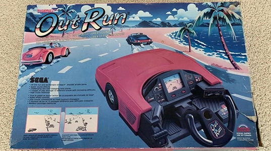 Image showing a boxed Grandstand OutRun LCD driving wheel