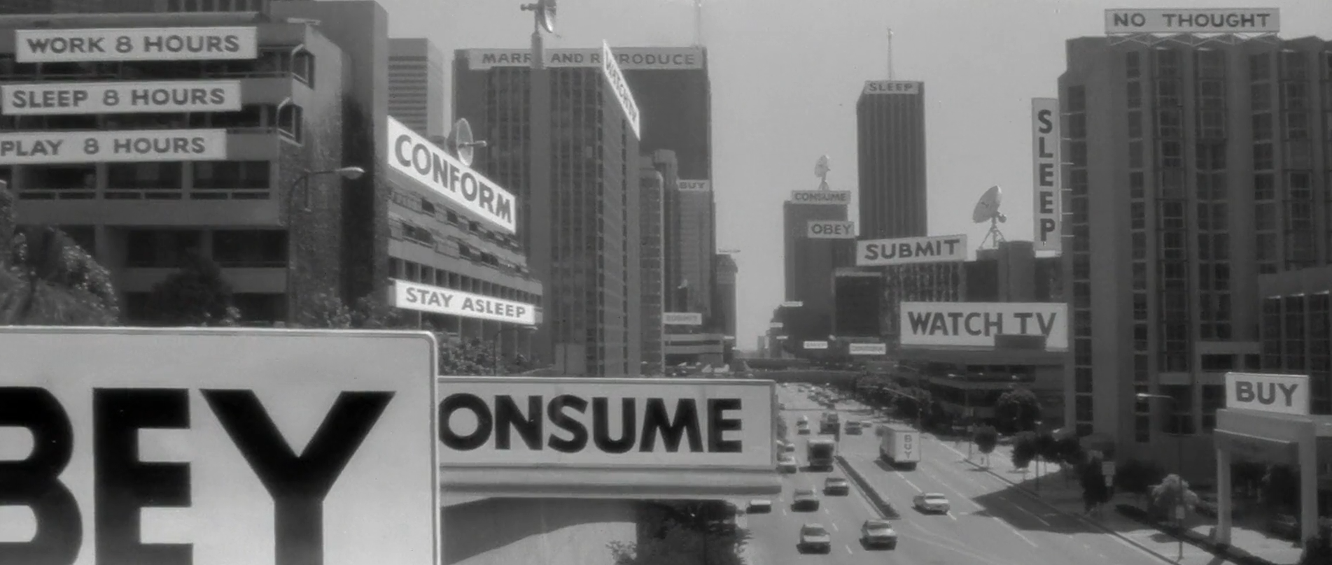 Subliminal messages and alien-controlled billboards seen by John Nada in They Live (1988)