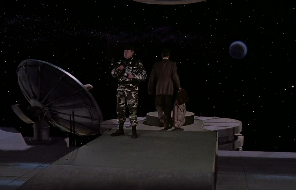 Nada witnessing aliens teleport in an underground facility in They Live (1988)