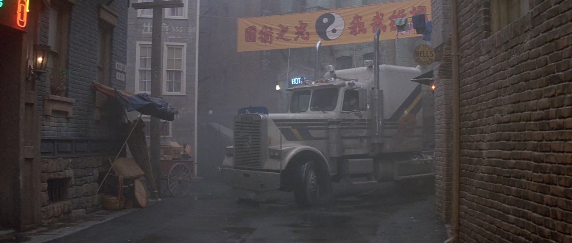 Image shows Jack Burtonâs white truck turning into a busy Chinatown street at night