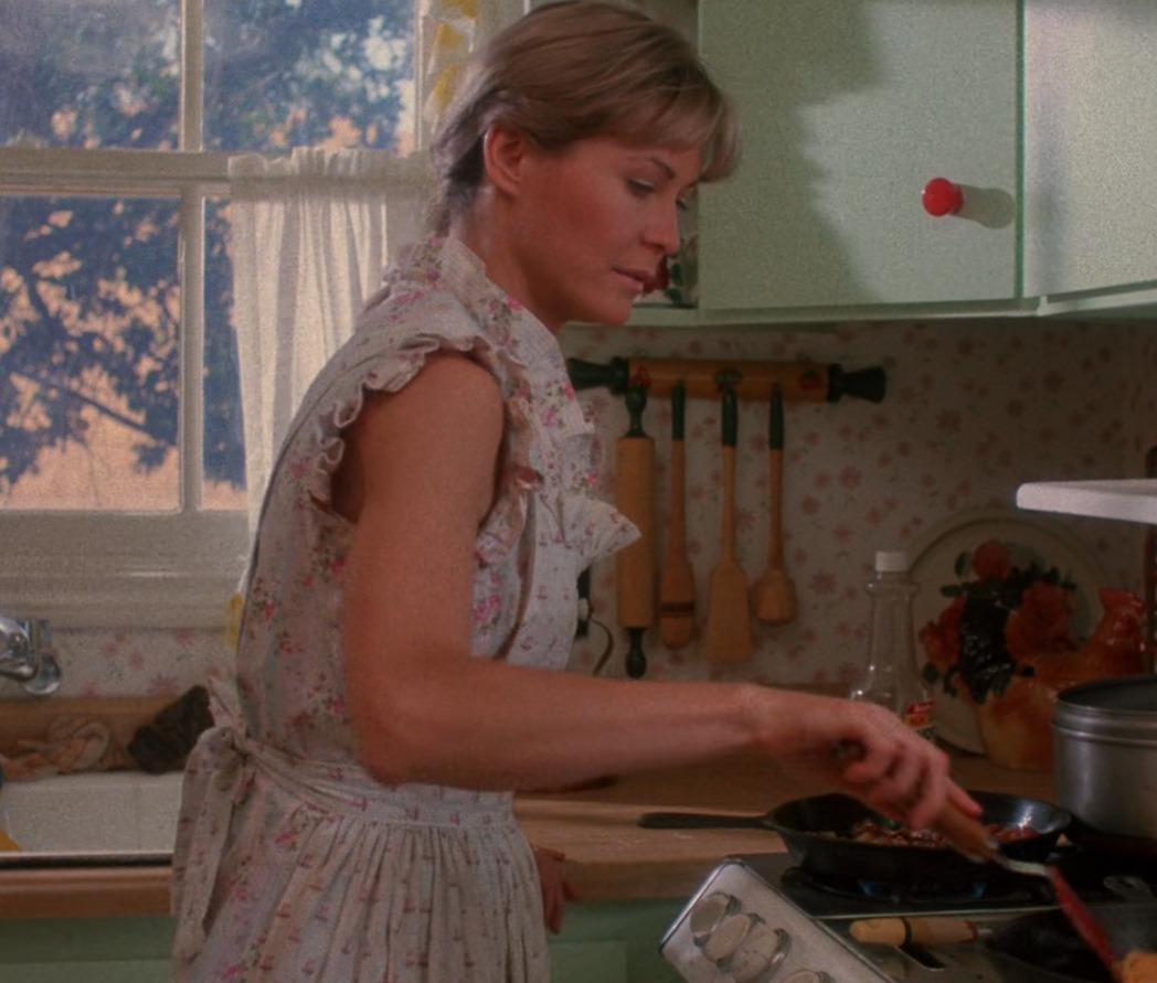 Helen Brown cooking breakfast in a kitchen scene from Critters (1986)