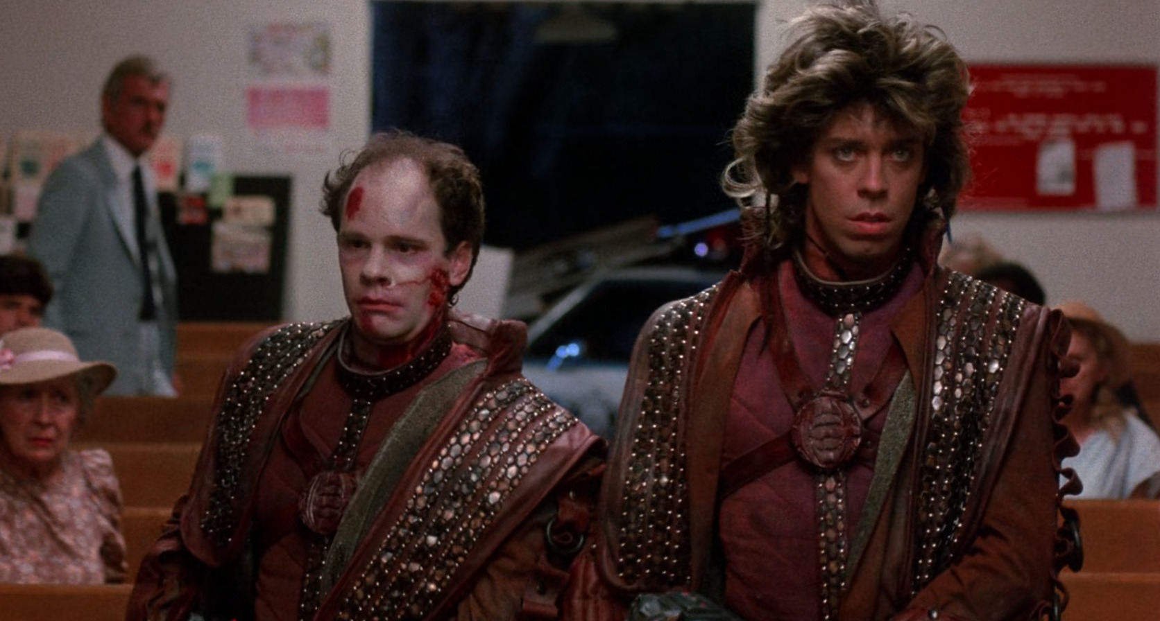 Ug the alien enters a church in a scene from Critters (1986)