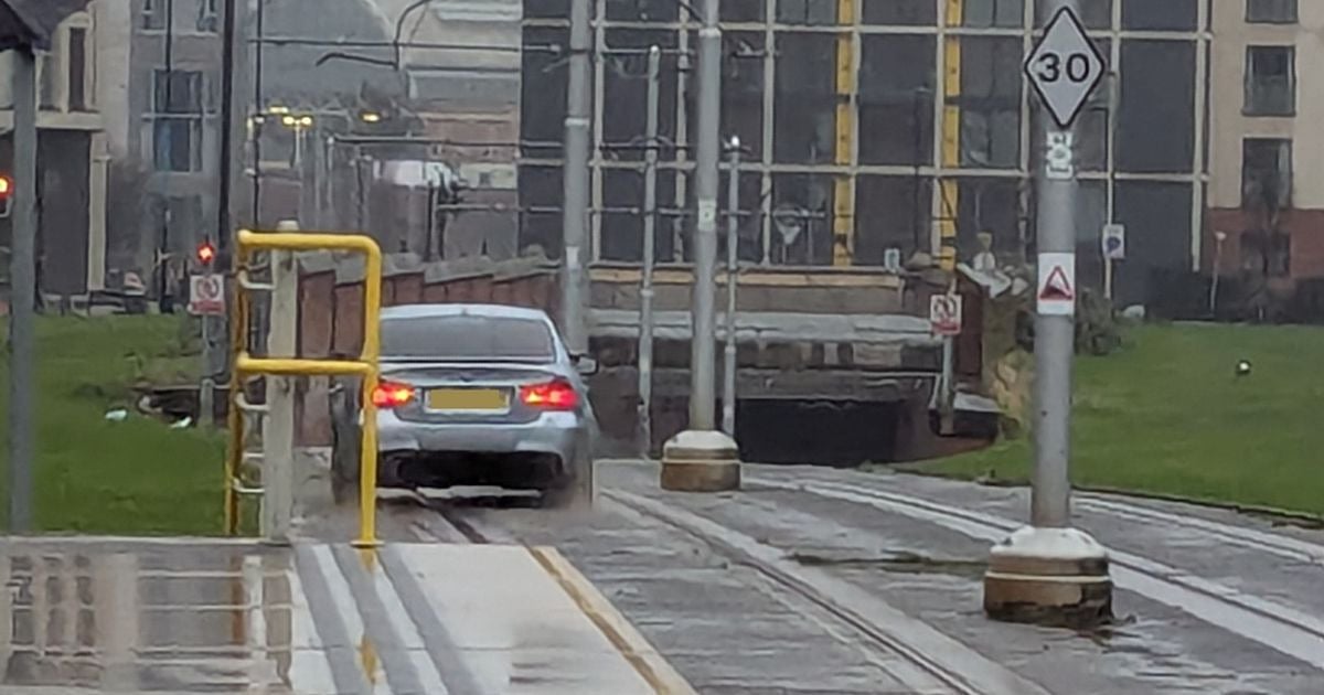 Metrolink services suspended after car drives onto tram tracks in Manchester