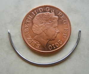 Penny and curved needle