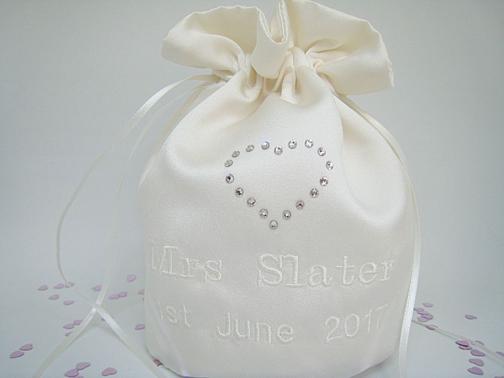 A Satin Dolly Bag With Designer Love Heart On The Front.