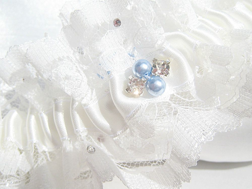 Garters With Blue Pearls Hand Stitched Onto The Lace.