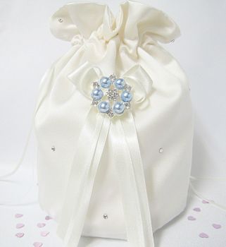 Satin dolly bag which has blue pearls on it and crystals.