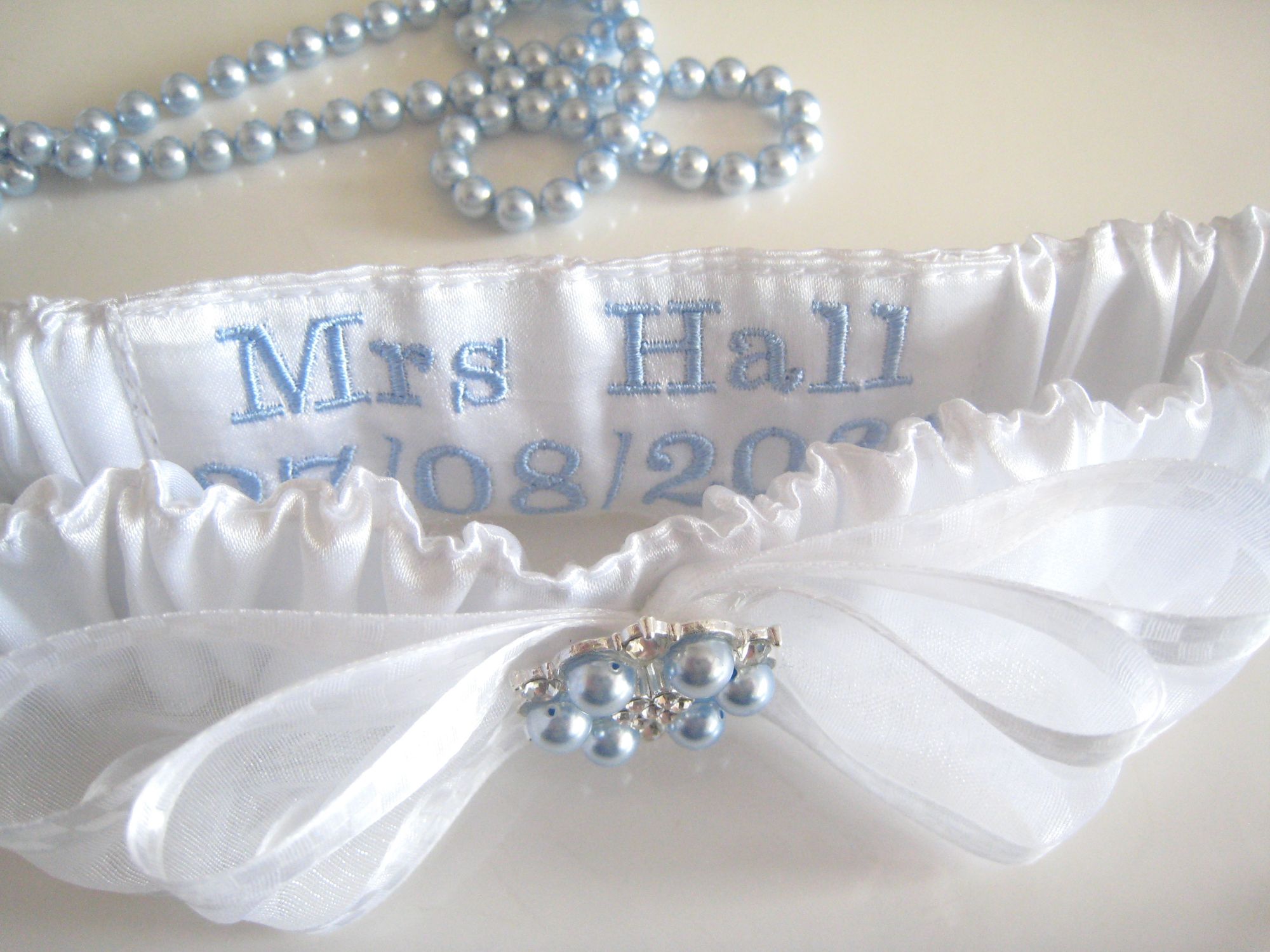 Blue Wedding garter with blue embroidery inside