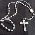 White plastic prison issue rosary beads