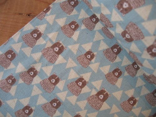 kokka bears in triangular mountains in blue