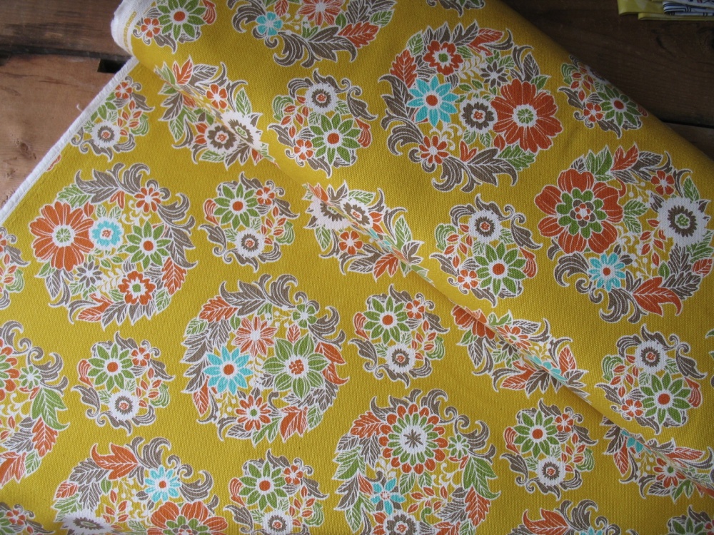 Cosmo Japanflower medallions on a mustard heavier weight canvas 