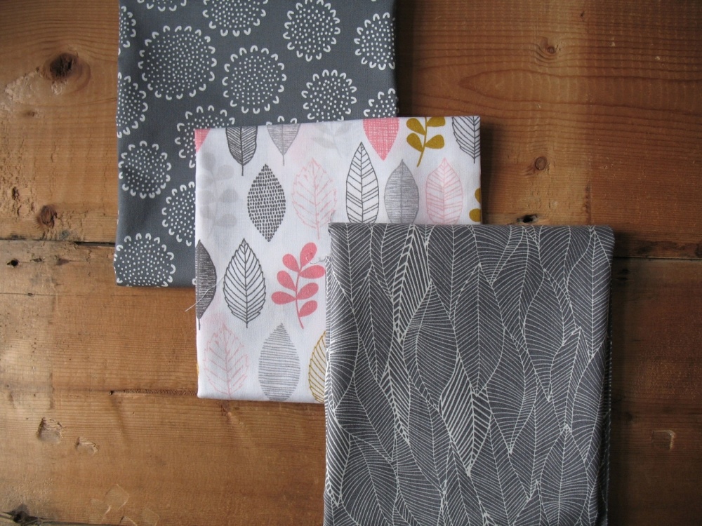 Valori Wells in the bloom leaves in charcoal