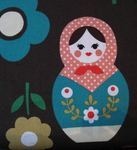Kokka Dotty Russian dolls with blooms on brown