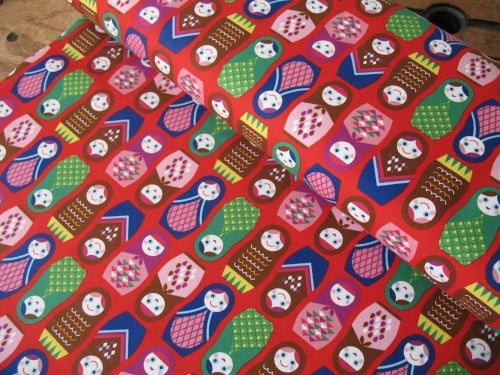 Kokka Happy Russian dolls on red