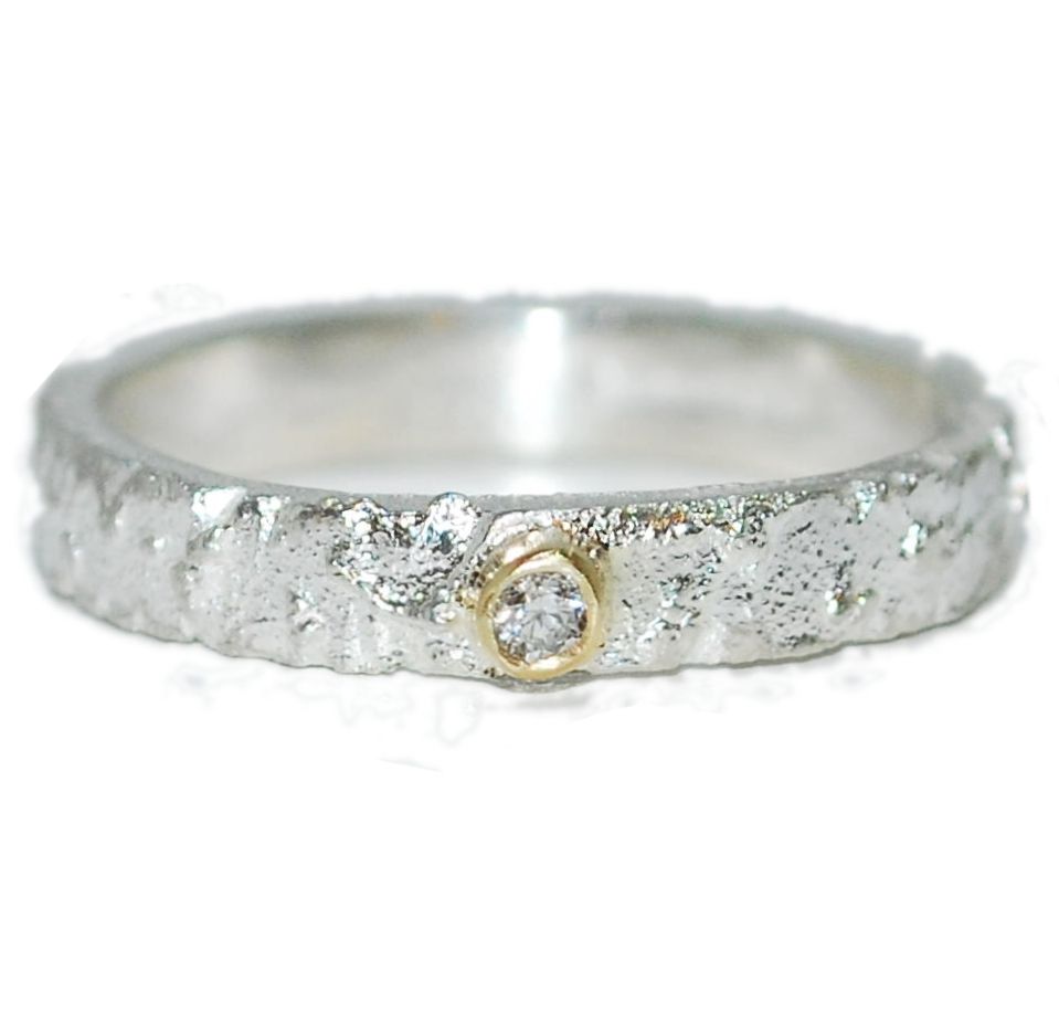 Texutured handmade silver ring with Diamond and gold setting