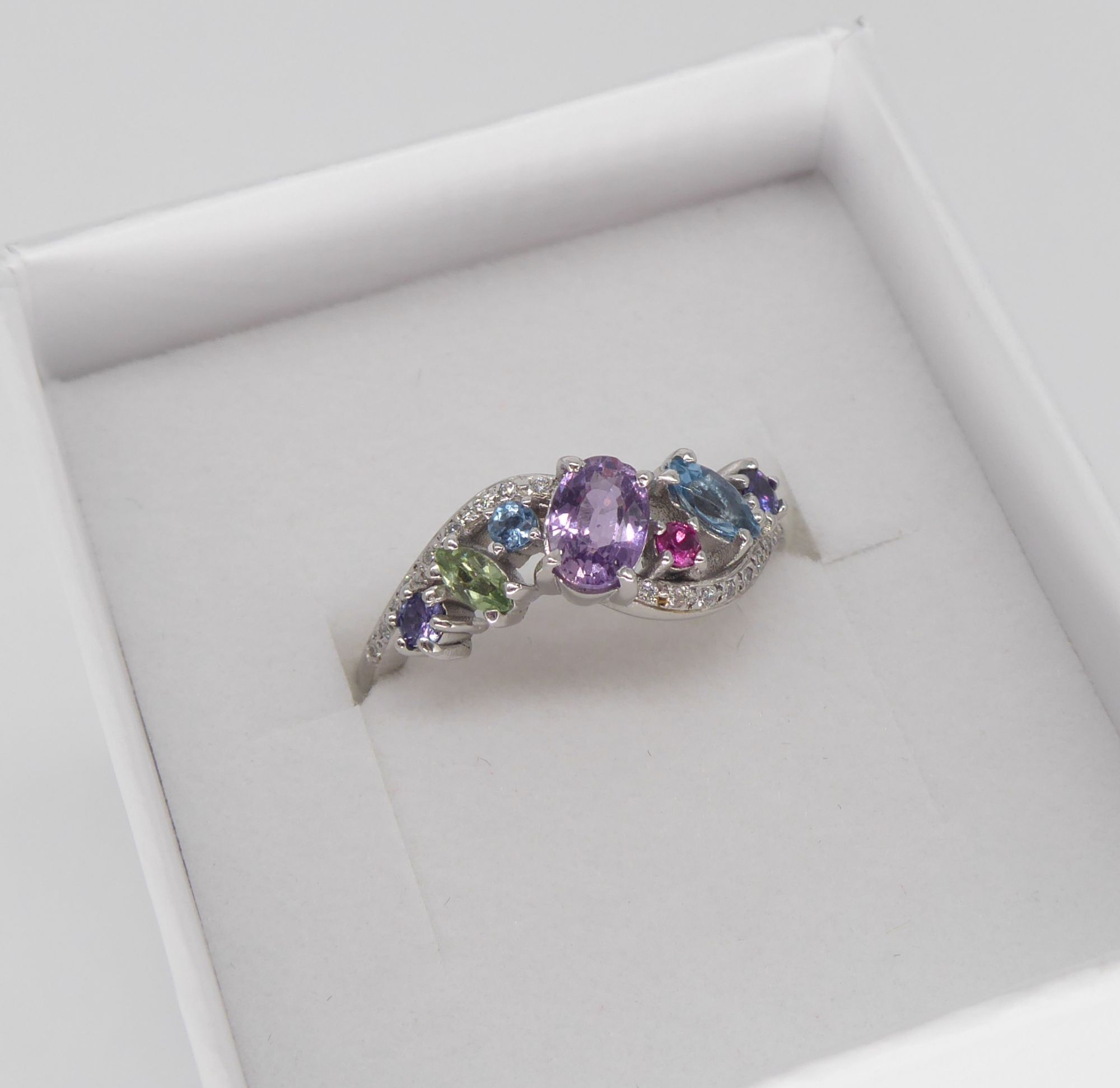 Multi coloured sapphire engagement ring