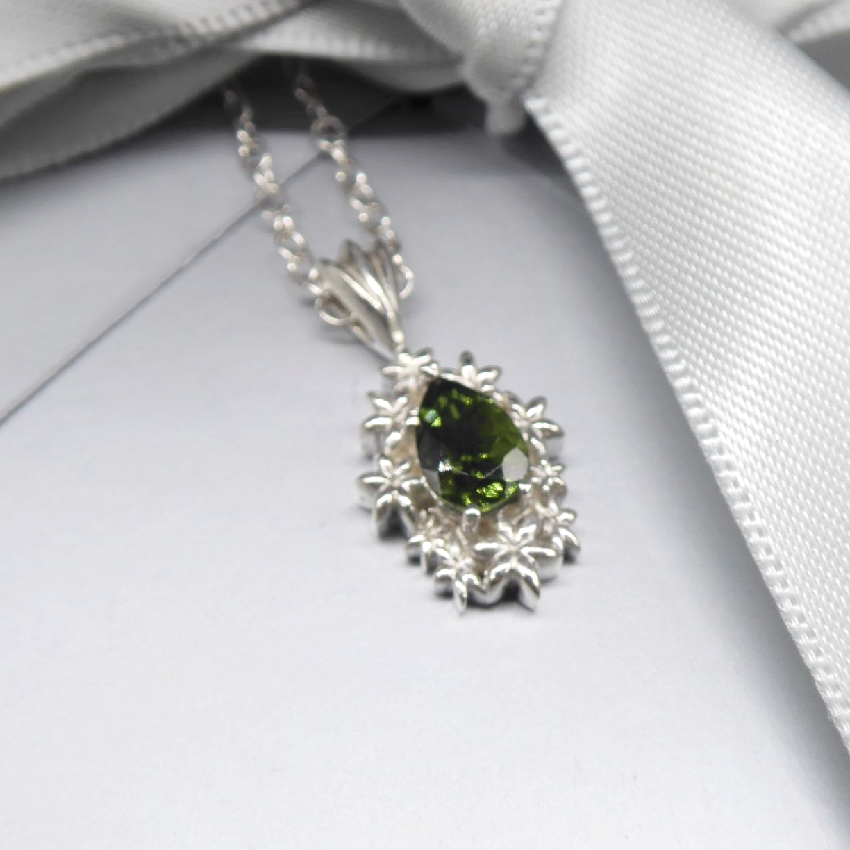 Silver and green tourmaline flower patterened pendant