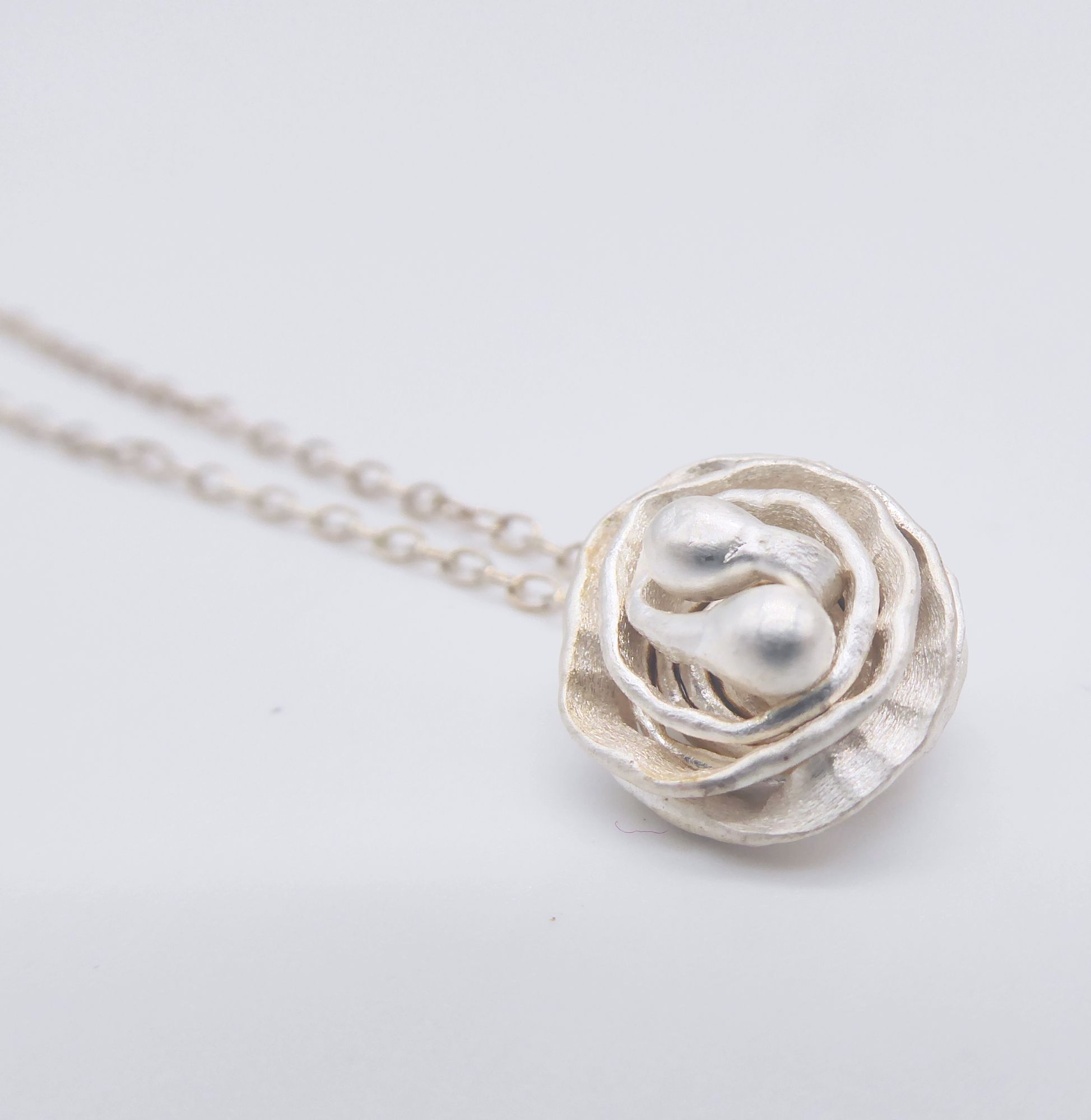 Silver rose pendant