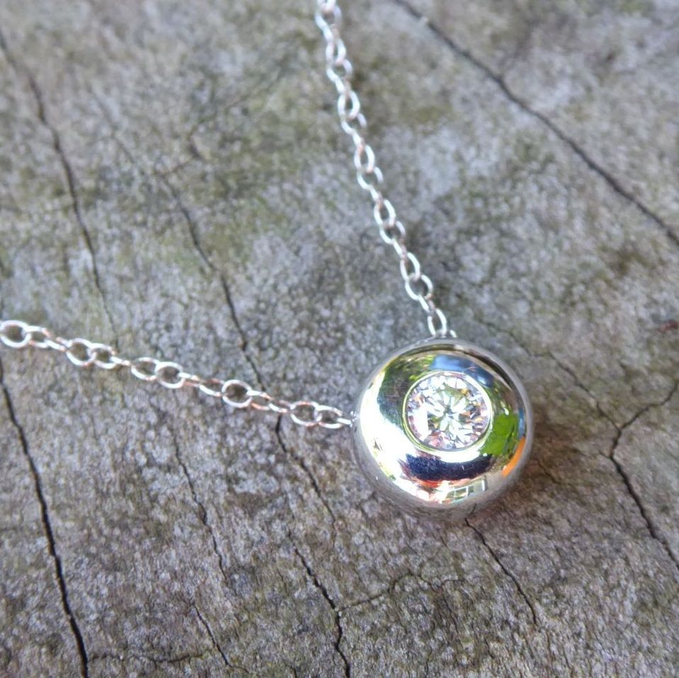 Floating white gold and diamond pendant