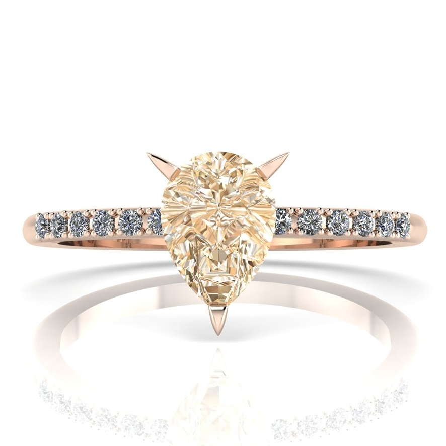 Pear shaped champagne diamond rose gold engagement ring with spiky claw setting