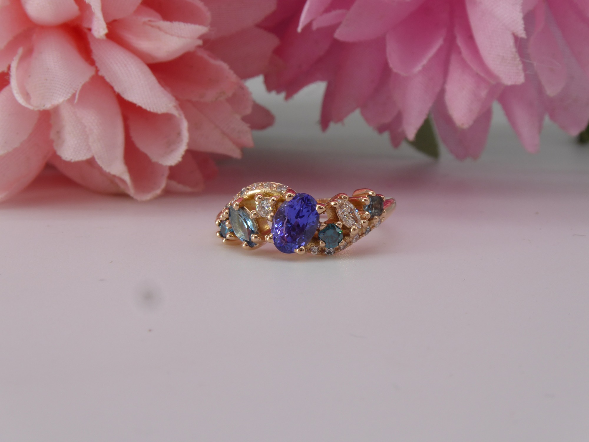 The Atlantis Storm - rose gold tanzanite and blue diamond engagement ring