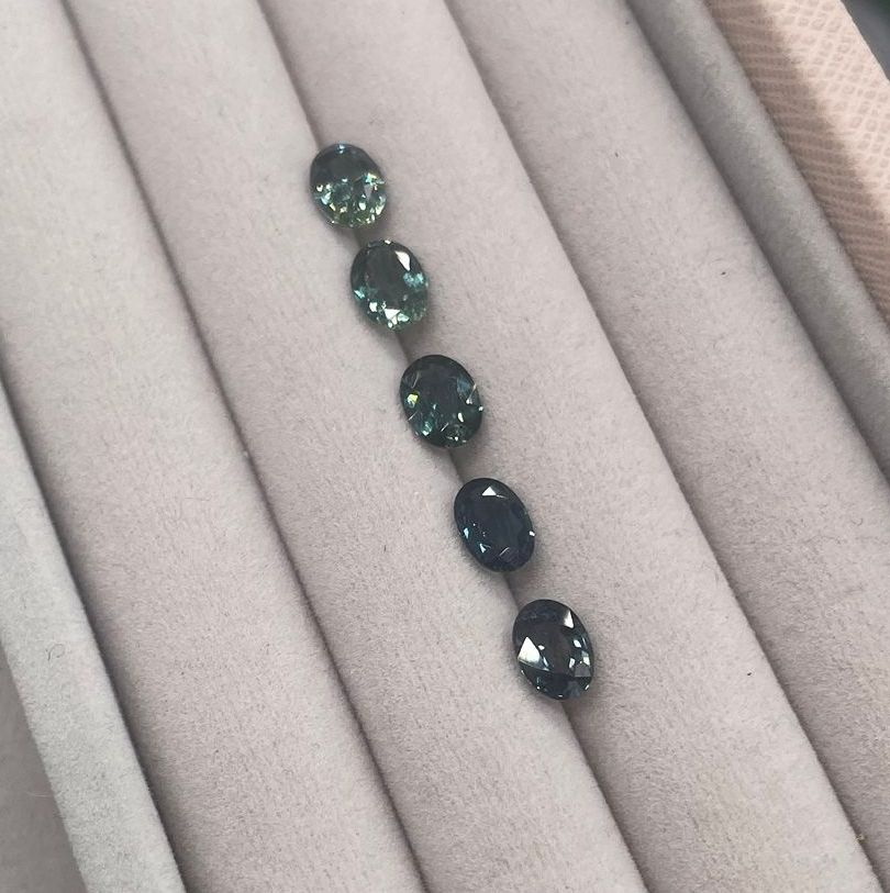 A selection of green and teal sapphires of different shade.