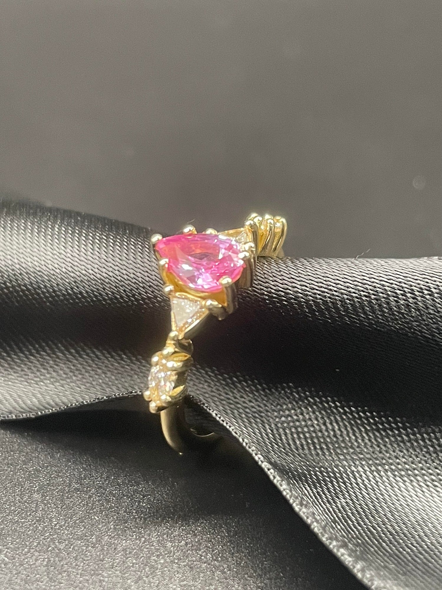 A bespoke version of The Maisie ring with a pear shaped pink sapphire