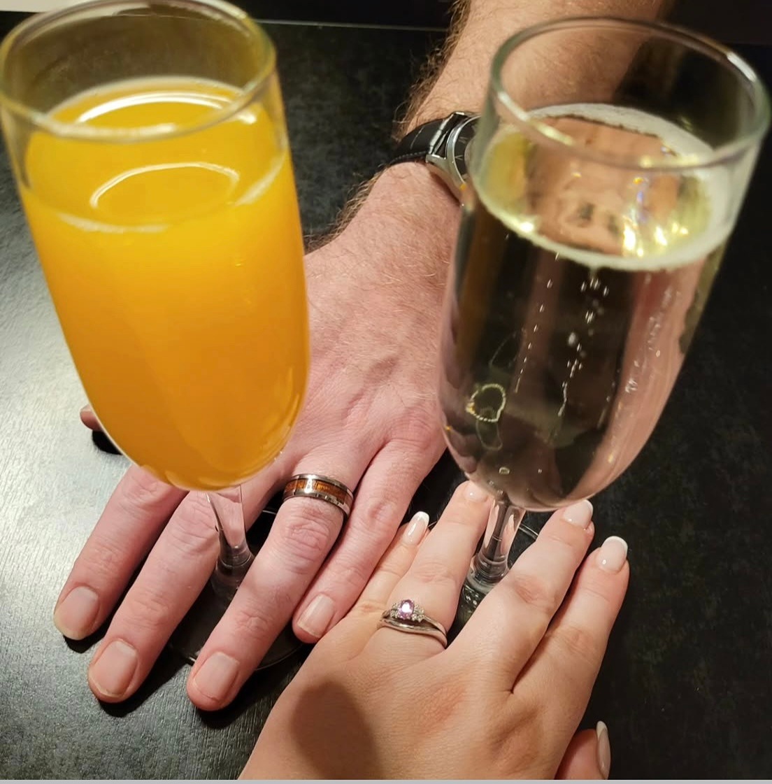 Jo&acirc;s shaped wedding band fitting against her ring