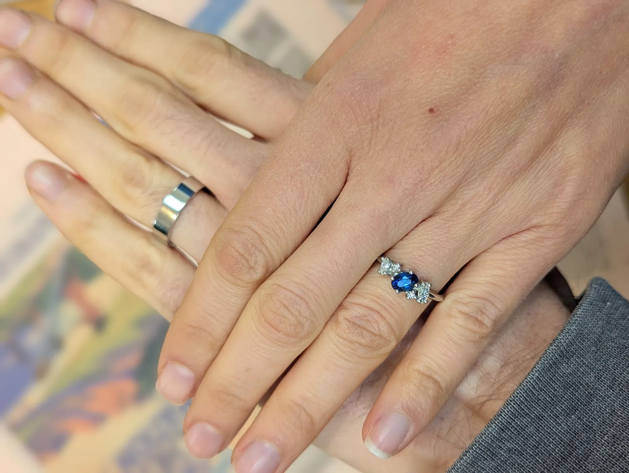 Handmade asymmetrical engagement ring with sapphire and diamonds.