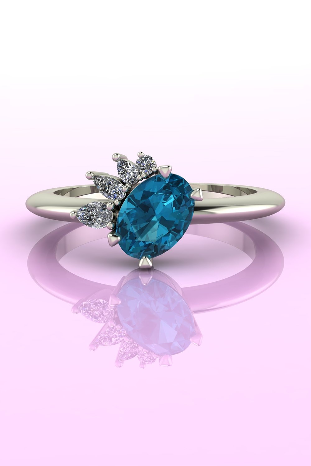 The Selene oval central gemstone asymmetrical engagement ring with a teal sapphire and diamonds