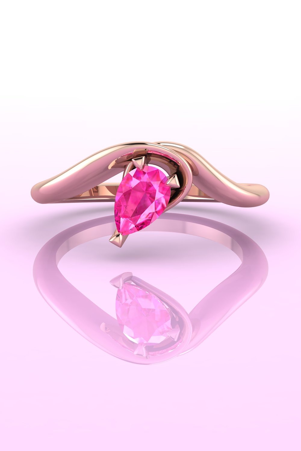 A rose gold and pear shaped pink sapphire asymmetrical engagement ring