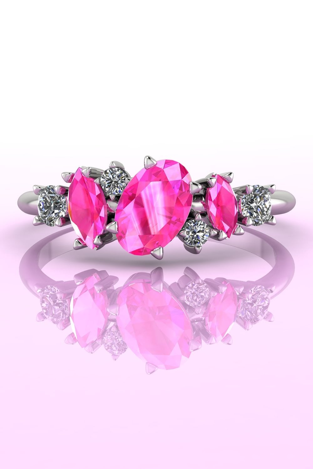 The Atlantis Paradise pink sapphire and diamond asymmetrical cluster ring in white gold.