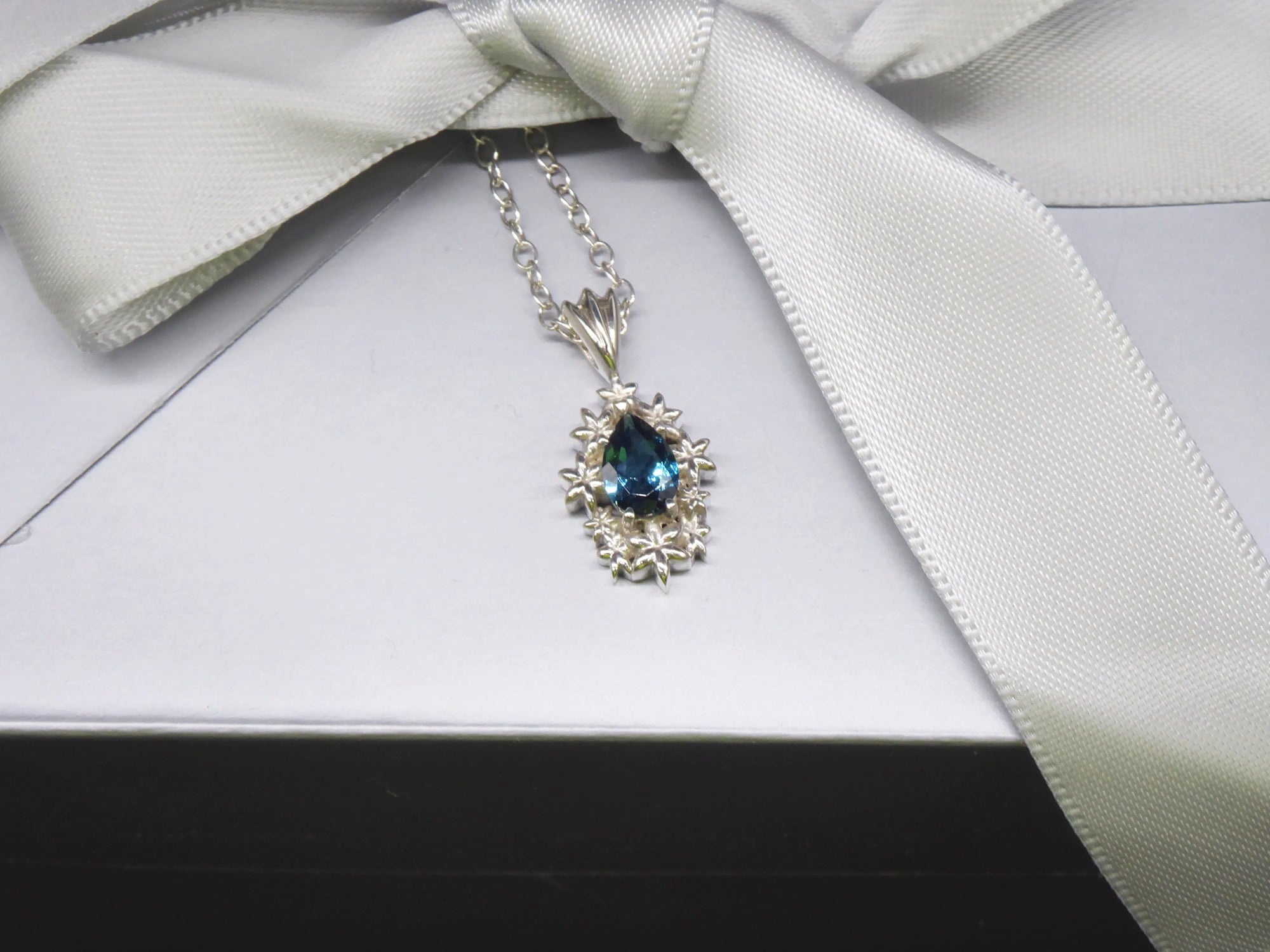 Fleur London Blue Topaz pendant in a handcrafted floral setting