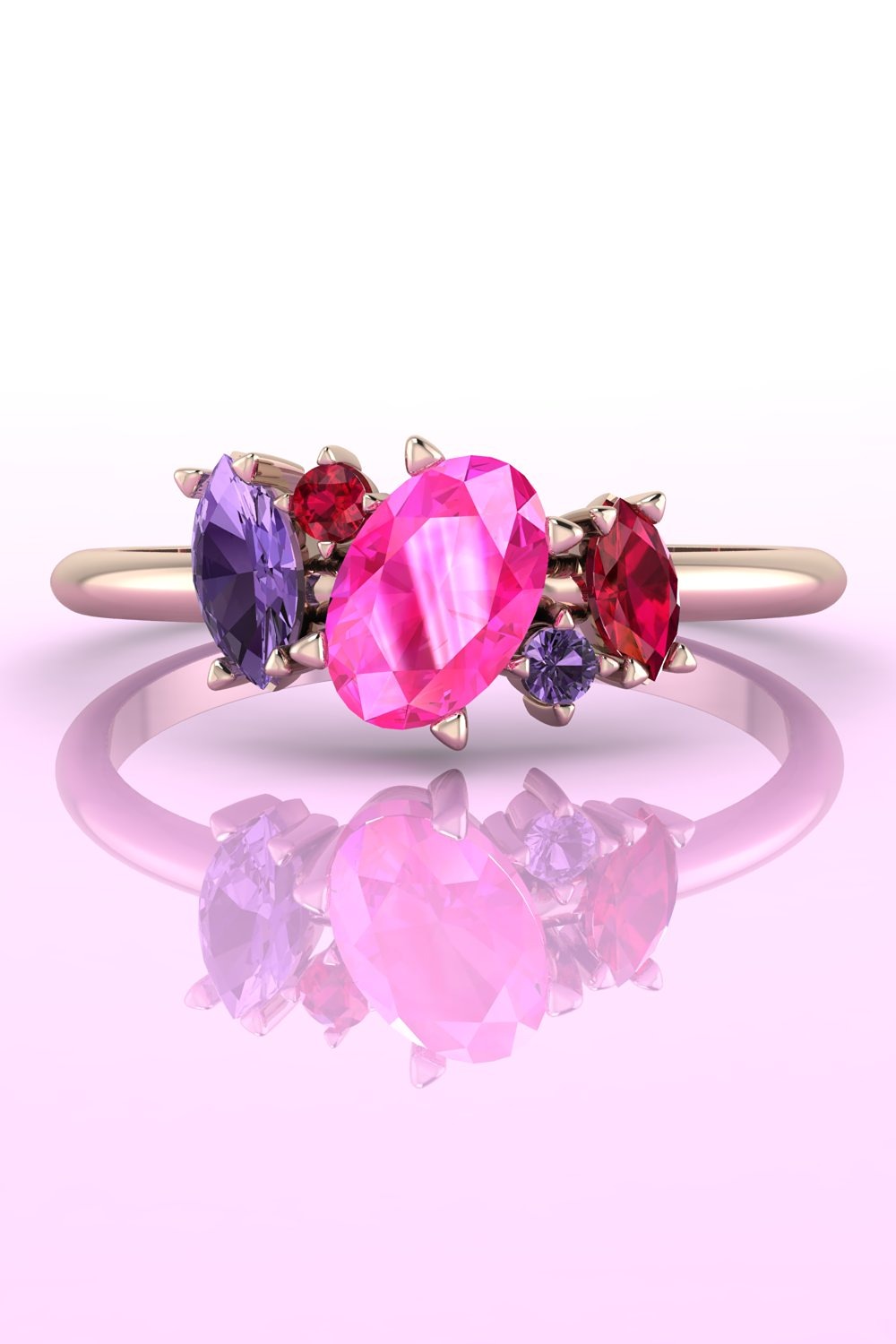 Atlantis five-stone engagement ring featuring a vibrant colour clash of pink sapphires and rubies