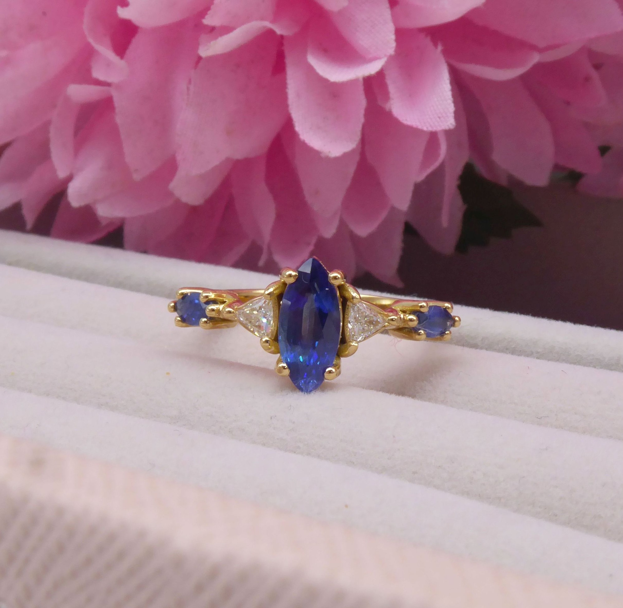 Handcrafted Maisie five-stone engagement ring in 18ct rose gold with a marquise sapphire