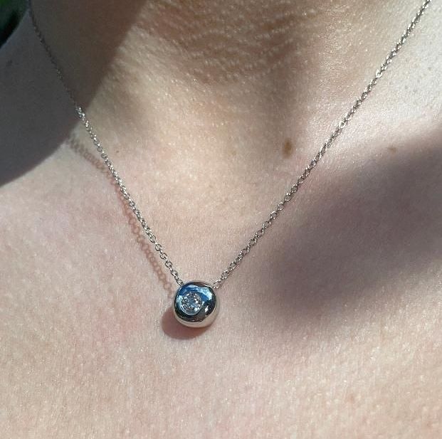 Ethical diamond necklaces and handcrafted diamond pendants in white and yellow gold.