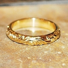 Bespoke yellow gold hand engraved ring