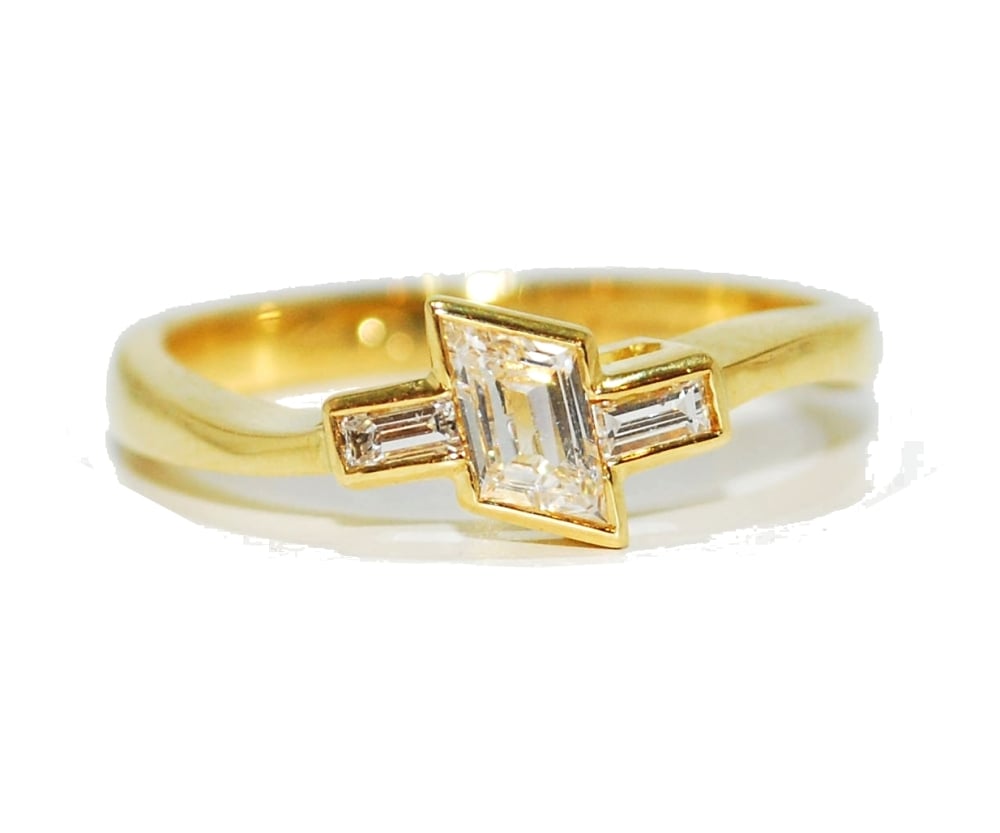 Asymetrical yellow gold unusual diamond engagement ring