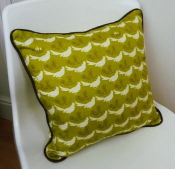 Cushon design piped cushion on chair