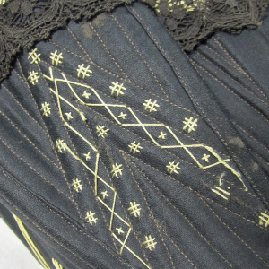 Vicorian decorative corset flossing on a black corset