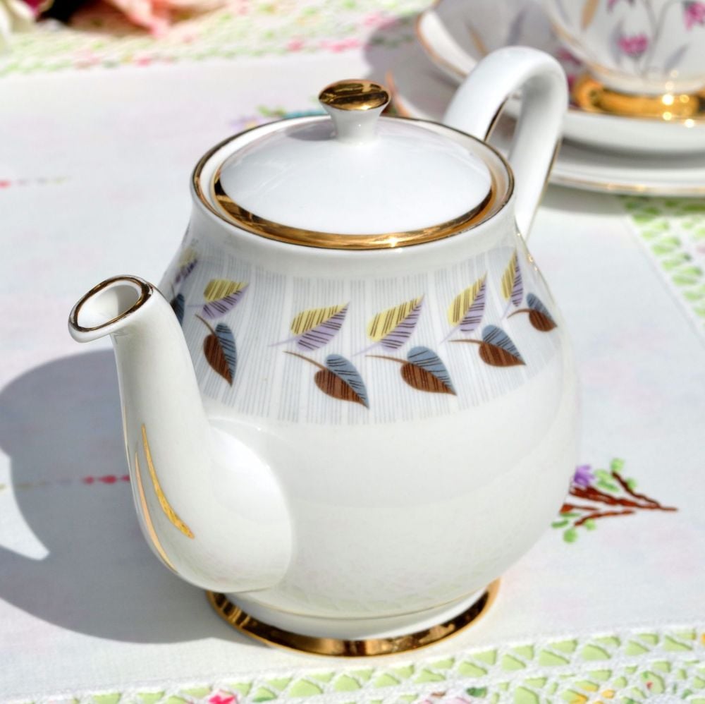 Vintage small teapot with gold