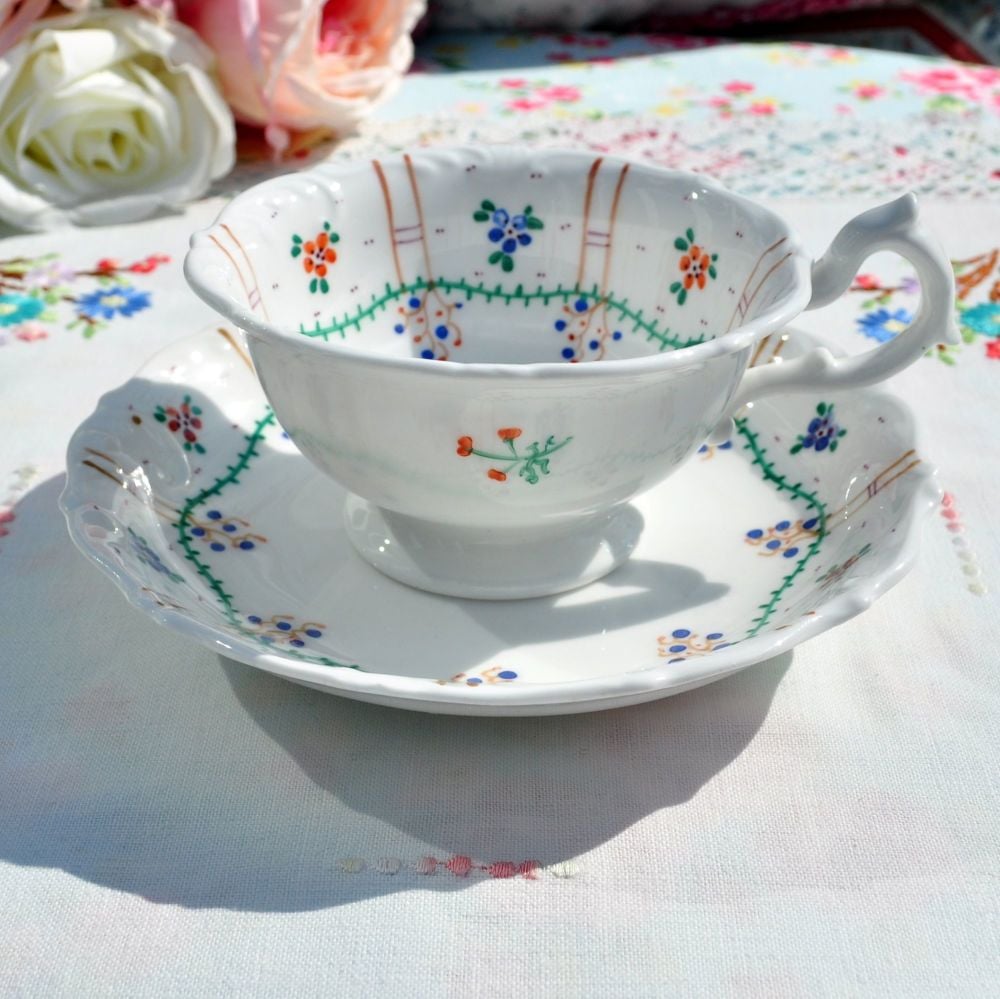 Antique Hand Painted Embossed Teacup and Saucer